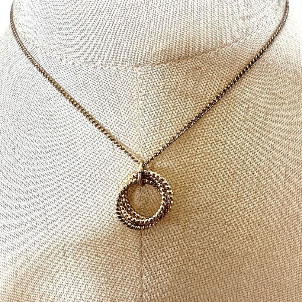 Gold tone triple circle pendant necklace